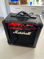 Front view showing faceplate, controls, logo, cabinet