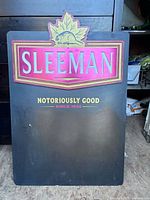 Full front view of Sleeman chalkboard sign showing dimensions and graphics