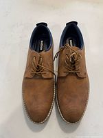 Top view of both shoes showing color, texture and lacing