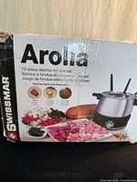 front of original box showing brand, model and image of complete fondue set