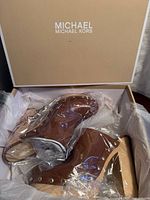 Clogs inside original box with packaging