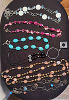 All six necklaces laid out for full view