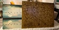 Both canvas artworks side by side showing relative sizes and subjects