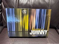 Outer slipcase front and spine showing Heeere’s Johnny title and curtain artwork