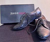 Shoes in front of Jeanne Beker box showing overall style and condition
