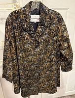 Front view of Maxime abstract silk jacket on hanger