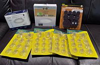 All retail-packaged items: LED fixtures, felt pads, suction hook packs
