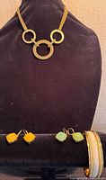 Group shot showing necklace, two earring pairs and bangle