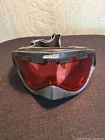 Front view of Arnette goggles showing pink lens and logo