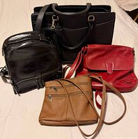 Group shot of four bags displaying sizes and colours