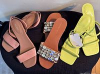All three pairs of sandals displayed from top view