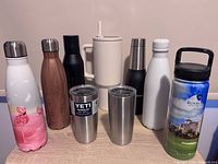 Group shot of all nine drinkware items