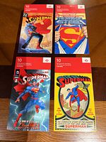 Front covers of four Superman stamp booklets