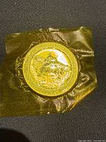 Obverse featuring lunar module, plastic wrap visible
