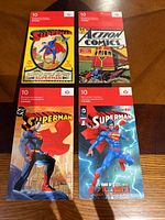 Front covers of four Superman 2013 stamp booklets
