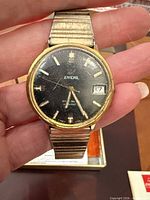 Front view of Enicar watch showing dial, case wear and bracelet