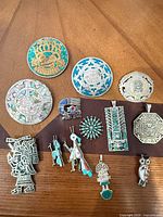 All 13 convertible silver pendants laid out for overview