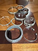 All nine sterling silver bracelets laid out