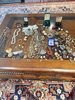 Full lot overview spread on table showing quantity and range of jewelry types