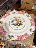 27 cm dinner plate showing Lady Carlyle pattern, pink border, floral centre, gold trim