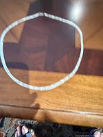 Full view of chain laid in circle showing overall length and style