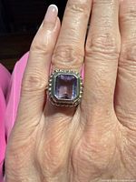 Top view showing amethyst and beaded bezel on hand