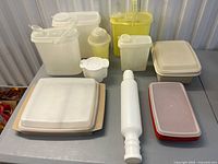 All ten Tupperware pieces arranged on table