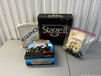 Overview of four board games: Sequence, Stage II trivia, train-themed tin game, chess set pieces in zip bag