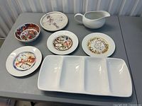 Front view of all seven ceramic pieces on table