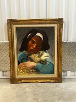 Front view of framed oil painting showing subject and frame detail