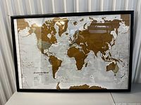 Full view of framed Scratch the World map