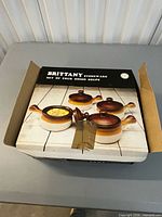 Outer box showing product image and brand Brittany stoneware set of four onion soups