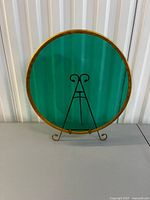 Front view emerald glass charger on stand