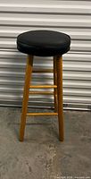 Full view of wood barstool front