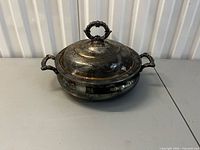Closed casserole showing lid, finial and handles