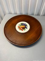 Top view showing wood surface and fruit tile center