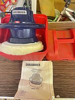 Waxer/polisher in carry case with manual visible