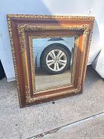Full view of mirror with ornate frame
