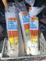 Three sealed rolls Frost King 3 mil plastic sheeting in bin