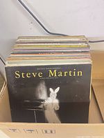 Box of vinyl LPs front showing Steve Martin album