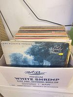 Box of vinyl LPs, Moody Blues album at front