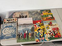 Top view of albums laid out showing titles and artwork