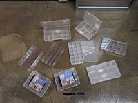 All nine organizer boxes arranged on floor showing variety of sizes and finishes