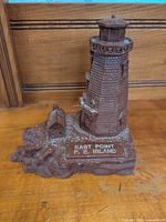Front angled view showing lighthouse, keeper’s house, plaque text