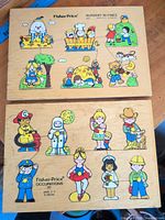 Both wooden peg puzzles side by side showing full boards and illustrations