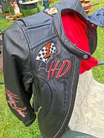 Front view showing red lining, #1 patch, HD script, zip front