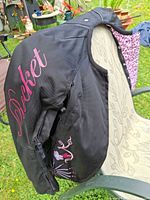 Side view showing Rocket script, floral embroidery and pink leopard lining