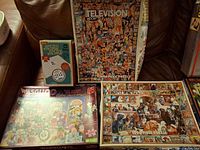 All four puzzle boxes displayed on couch