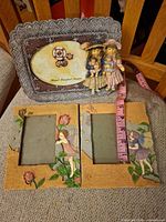 Front view showing one resin frame and two wood fairy frames