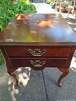 Top view of Queen Anne style mahogany end table showing finish and hardware
